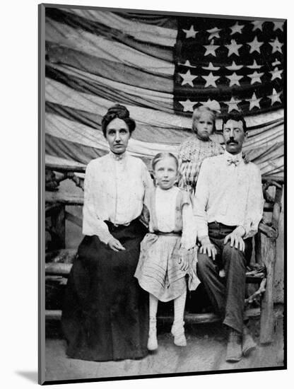 Family Pose in Front of American Flag, Ca. 1898-null-Mounted Photographic Print