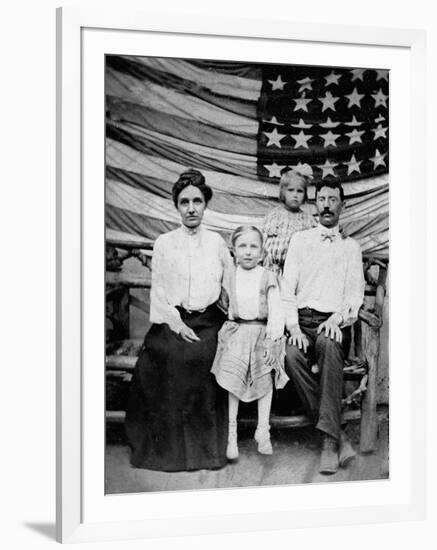 Family Pose in Front of American Flag, Ca. 1898-null-Framed Photographic Print