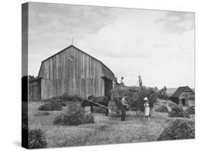 Family Praying During Farm Work-John Phillips-Stretched Canvas