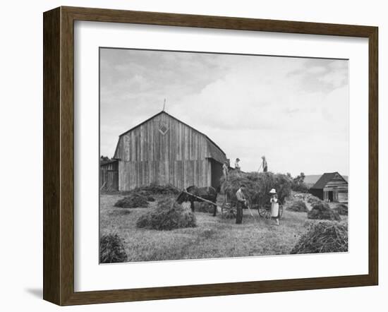 Family Praying During Farm Work-John Phillips-Framed Photographic Print
