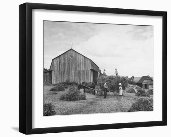 Family Praying During Farm Work-John Phillips-Framed Photographic Print