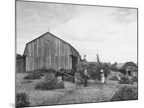 Family Praying During Farm Work-John Phillips-Mounted Photographic Print