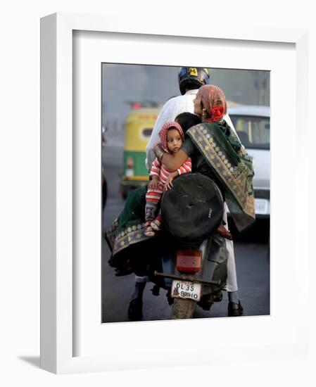 Family Rides on a Two-Wheeler in New Delhi, India-null-Framed Photographic Print