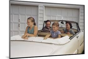 Family Sitting in Car Outside Garage-William P. Gottlieb-Mounted Photographic Print