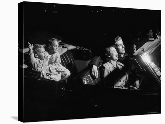 Family Sitting in Convertible Watching Movie at Drive In-Francis Miller-Stretched Canvas