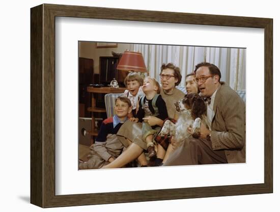 Family Sitting on Couch Together-William P. Gottlieb-Framed Photographic Print