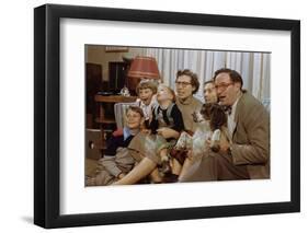 Family Sitting on Couch Together-William P. Gottlieb-Framed Photographic Print
