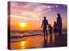 Family Walking on the Beach at Sunset-Rawpixel-Stretched Canvas