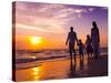 Family Walking on the Beach at Sunset-Rawpixel-Stretched Canvas