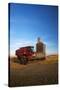 Farm Combine Parked by Silo, Palouse Country, Washington, USA-Terry Eggers-Stretched Canvas