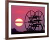 Farm Equipment is Silhouetted by a Setting Sun-null-Framed Photographic Print