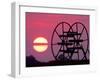 Farm Equipment is Silhouetted by a Setting Sun-null-Framed Photographic Print