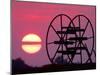 Farm Equipment is Silhouetted by a Setting Sun-null-Mounted Photographic Print