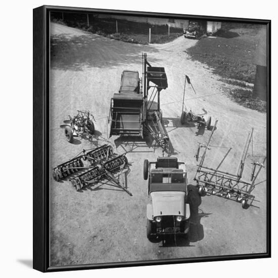 Farm Equipment Surrounding a Farmer's Jeep in Demonstration of Postwar Uses for Military Vehicles-Myron Davis-Framed Photographic Print