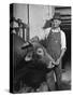 Farm Worker Petting One of the Cows Living on a Dairy Farm-Hansel Mieth-Stretched Canvas