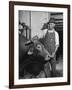 Farm Worker Petting One of the Cows Living on a Dairy Farm-Hansel Mieth-Framed Photographic Print