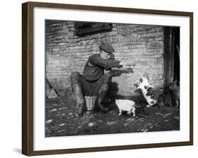 Farmer Feeding Cats-null-Framed Photographic Print