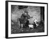 Farmer Feeding Cats-null-Framed Photographic Print