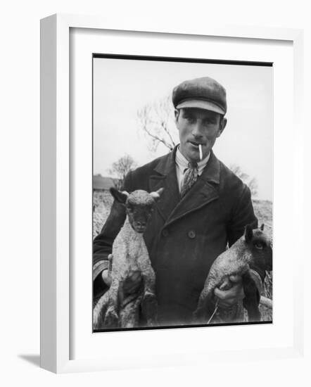 Farmer Holding His New Born Lambs in the Cotswolds-Henry Grant-Framed Photographic Print