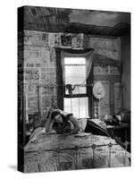 Farmer's Daughter Delphaline, Reading a Book as She Lies on Iron Bed in Her Bedroom-Alfred Eisenstaedt-Stretched Canvas