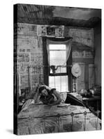 Farmer's Daughter Delphaline, Reading a Book as She Lies on Iron Bed in Her Bedroom-Alfred Eisenstaedt-Stretched Canvas