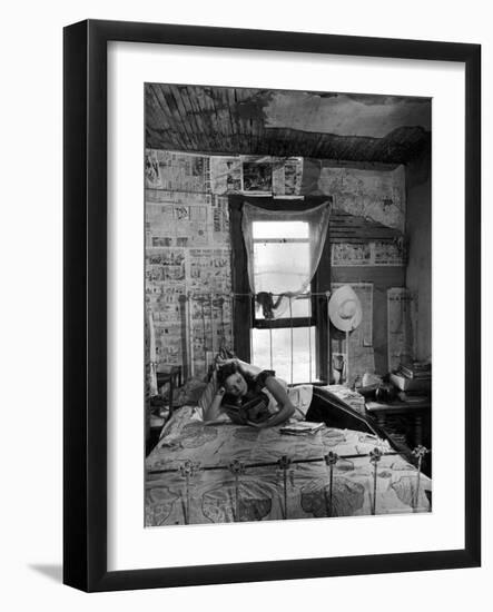 Farmer's Daughter Delphaline, Reading a Book as She Lies on Iron Bed in Her Bedroom-Alfred Eisenstaedt-Framed Photographic Print