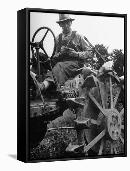 Farmer Sitting on Plow-null-Framed Stretched Canvas