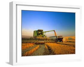 Farmer Unloading Wheat from Combine Near Colfax, Washington, USA-Chuck Haney-Framed Photographic Print