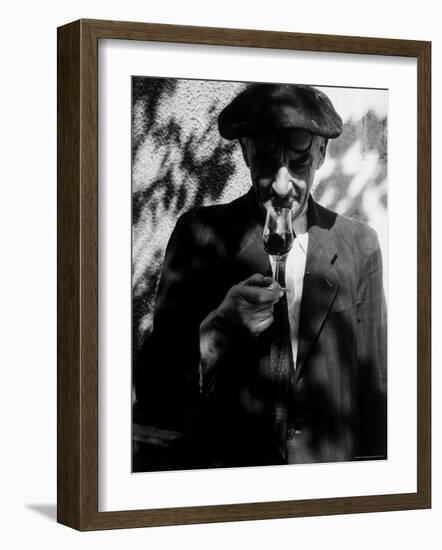 Farmer Who Has Brought His Grapes to the Hennessy and Co. Distillery Sampling Some Brandy-Gjon Mili-Framed Photographic Print