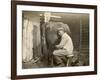 Farmworker Milks a Cow by Hand in a Very Primitive Cow- House-null-Framed Photographic Print