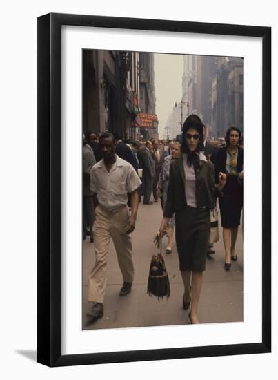 Fashion Model Brigitte Wasserman Walks Along 7th Avenue, New York, New York, 1960-Walter Sanders-Framed Photographic Print