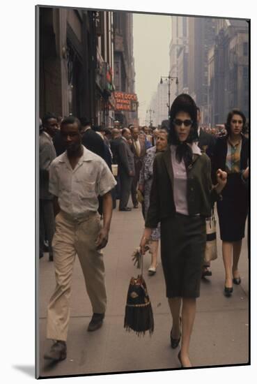 Fashion Model Brigitte Wasserman Walks Along 7th Avenue, New York, New York, 1960-Walter Sanders-Mounted Photographic Print