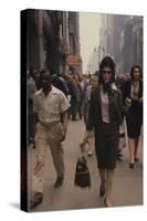 Fashion Model Brigitte Wasserman Walks Along 7th Avenue, New York, New York, 1960-Walter Sanders-Stretched Canvas
