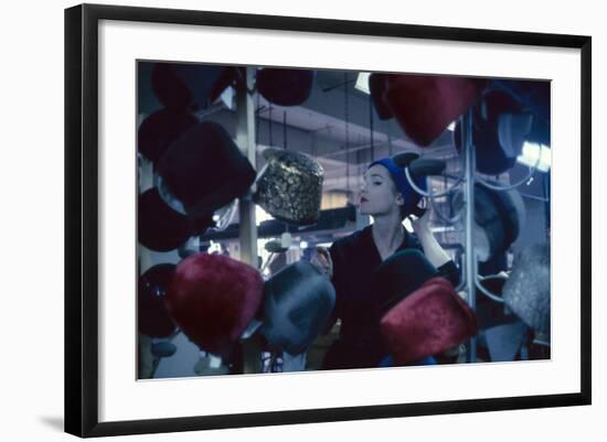 Fashion Model Katherine Gill Tries on a Hat at Christian Dior, New York, New York, 1960-Walter Sanders-Framed Photographic Print