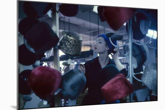 Fashion Model Katherine Gill Tries on a Hat at Christian Dior, New York, New York, 1960-Walter Sanders-Mounted Photographic Print