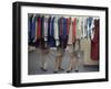 Fashion Models Behind a Suit Rack Trying on Clothes at Zelinka-Matlick, New York, New York, 1960-Walter Sanders-Framed Photographic Print