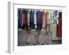 Fashion Models Behind a Suit Rack Trying on Clothes at Zelinka-Matlick, New York, New York, 1960-Walter Sanders-Framed Photographic Print