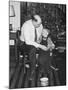 Father and Son Enjoy Christmas Morning, Ca. 1950-null-Mounted Photographic Print