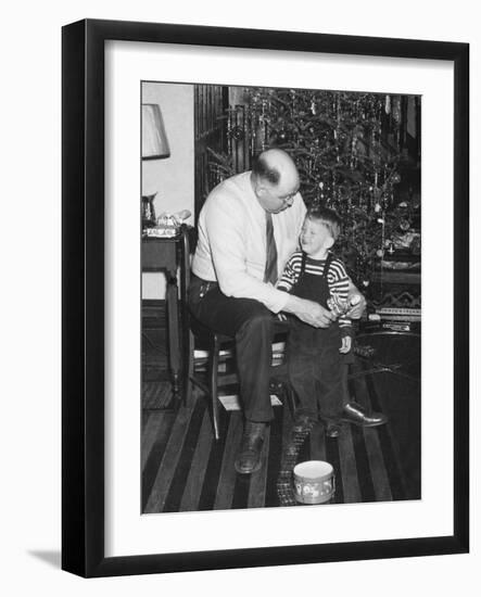 Father and Son Enjoy Christmas Morning, Ca. 1950-null-Framed Photographic Print