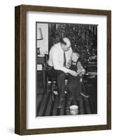 Father and Son Enjoy Christmas Morning, Ca. 1950-null-Framed Photographic Print