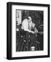 Father and Son Enjoy Christmas Morning, Ca. 1950-null-Framed Photographic Print