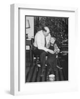 Father and Son Enjoy Christmas Morning, Ca. 1950-null-Framed Photographic Print