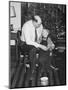 Father and Son Enjoy Christmas Morning, Ca. 1950-null-Mounted Photographic Print