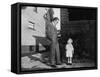 Father and Son Look at Each Other on Sidewalk, Ca. 1930.-Kirn Vintage Stock-Framed Stretched Canvas