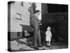 Father and Son Look at Each Other on Sidewalk, Ca. 1930.-Kirn Vintage Stock-Stretched Canvas
