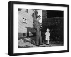 Father and Son Look at Each Other on Sidewalk, Ca. 1930.-Kirn Vintage Stock-Framed Photographic Print