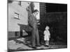 Father and Son Look at Each Other on Sidewalk, Ca. 1930.-Kirn Vintage Stock-Mounted Photographic Print