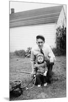 Father and Son Pull a Wagon in Backyard, Ca. 1946-null-Mounted Premium Photographic Print