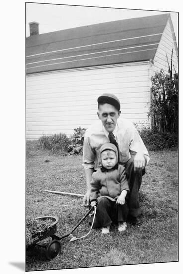 Father and Son Pull a Wagon in Backyard, Ca. 1946-null-Mounted Premium Photographic Print