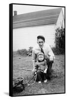 Father and Son Pull a Wagon in Backyard, Ca. 1946-null-Framed Stretched Canvas